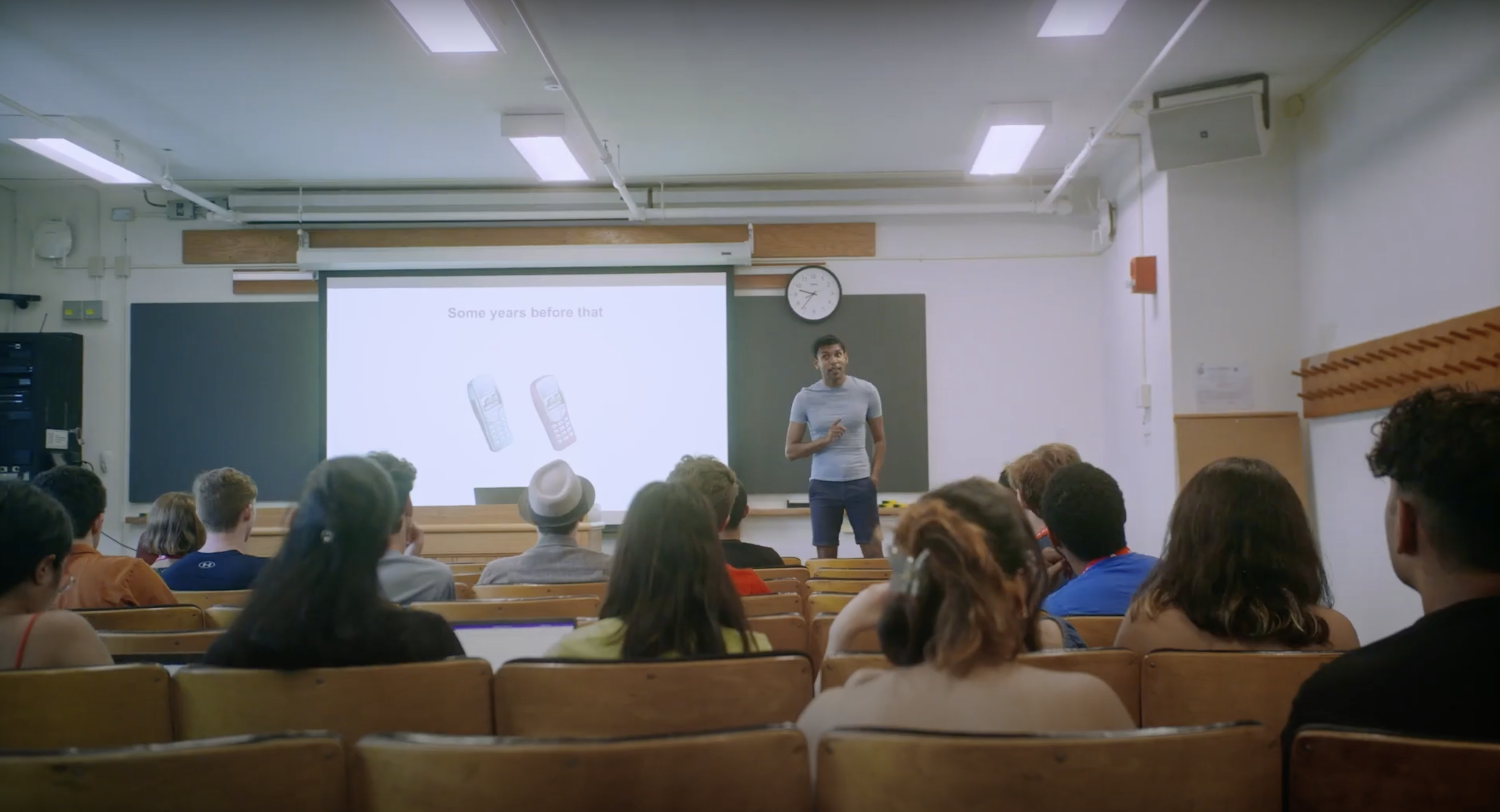 An instructor stands in front of a class of summer school students.